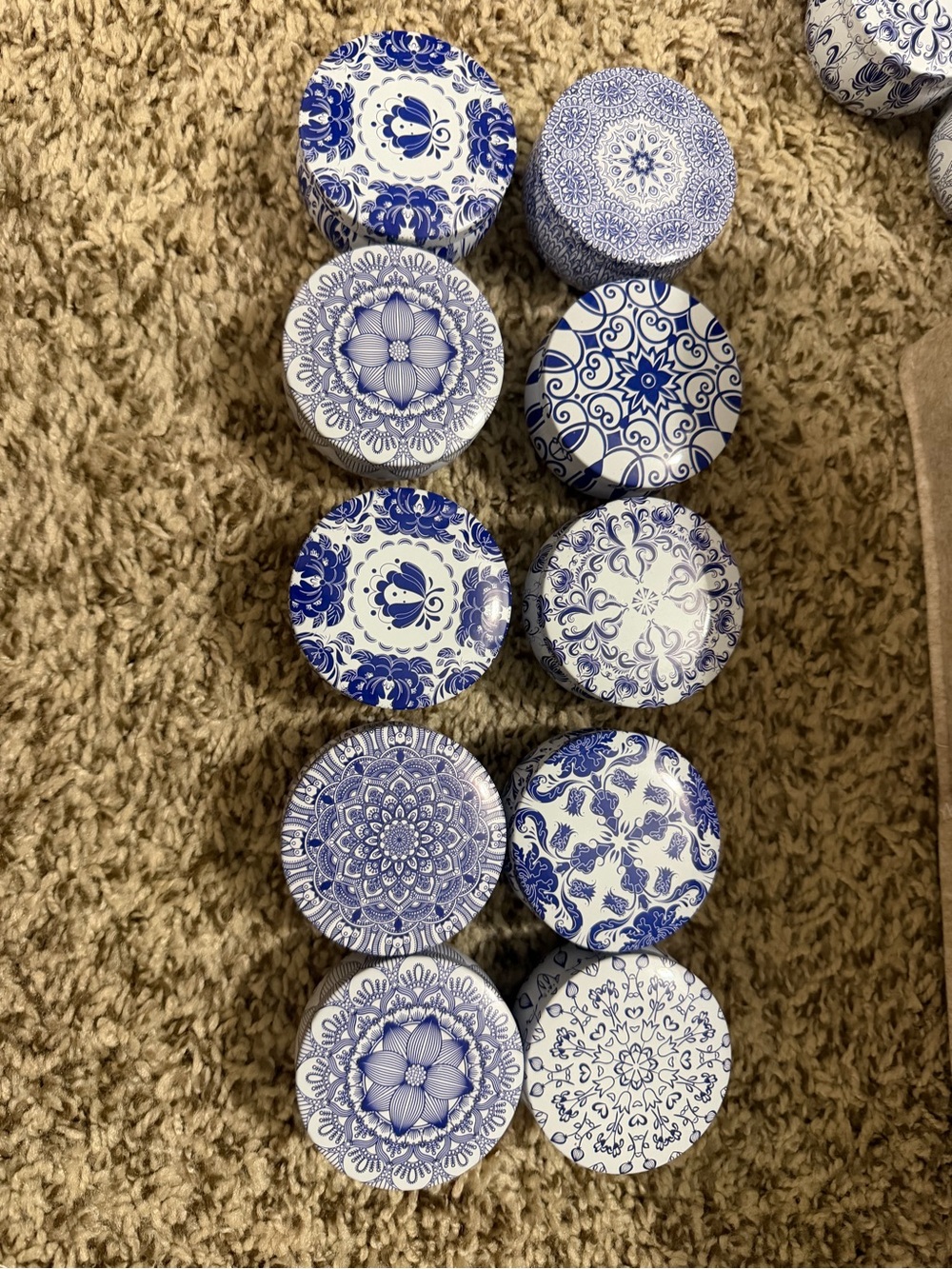 Candles Set of 10 Decorative Blue and White Round Tins with scented candles.